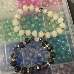 2 bracelets one thats gray and one with white beads💋